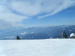 snowy landscape with mountains and fog