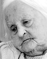 Black and white portrait of the old woman in sadness