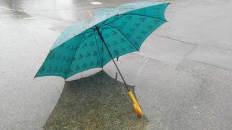 Rain Umbrella on pavement