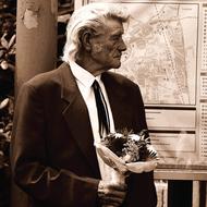 monochrome photo of an elderly man with a bouquet