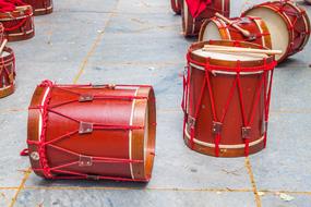 red drums on a road tile
