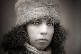 black and white portrait of a woman in a fur hat