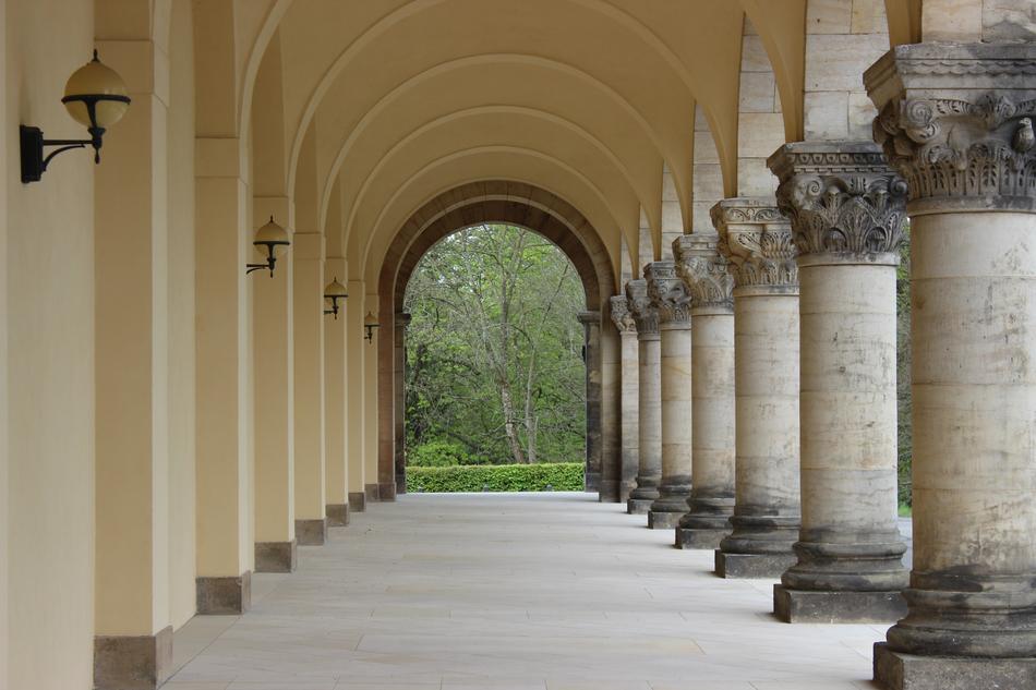 Beautiful terrace of the building with pillars, with view of the green plants, in Leipzig, Germany