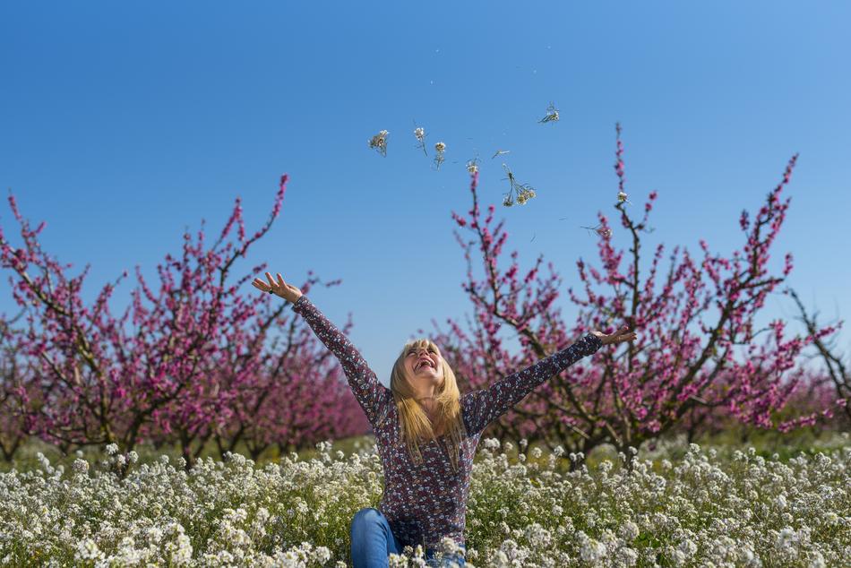 girl on the field with flowers