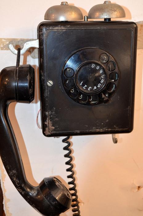vintage black phone on the wall close up