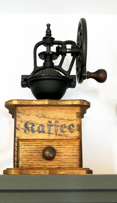old coffee grinder with a signature
