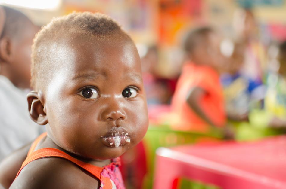 black skin baby with food