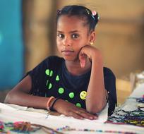 African American girl sitting at the table