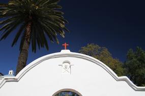 a red cross on a white roof