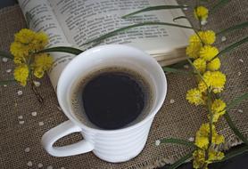 cup of coffee on a background of flowers