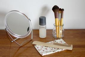 mirror with tassels by the wall