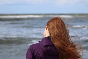 girl with long red hair is beautiful