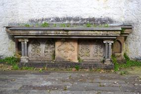 stone cemetery with green