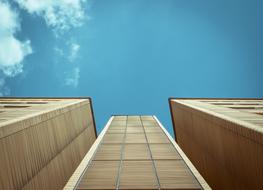 high-rise buildings with wooden facades