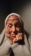 an old woman in a headscarf