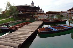 wooden bridge and fishing boats in the countryside