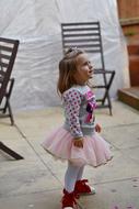 cute girl in a pink fluffy skirt