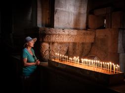 grandma at the candles in the church