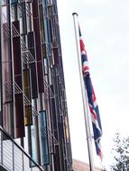 Building and colorful flags on the street in England