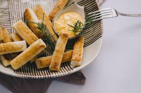 fried baked goods in sauce