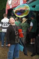boy with soap bubbles at the festival