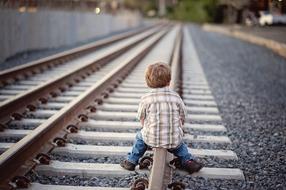 little boy on the railroad