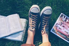 Books Shoes Person grass