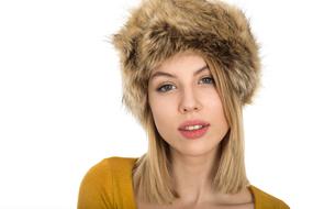 portrait of a beautiful girl in a fur hat