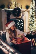 girl with a big box of christmas gifts