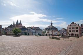 Beautiful cityscape of the Upper Square in Gelnhausen, Hesse, Germany, under the blue sky with clouds