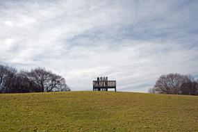 chairs with a table on a background of clouds