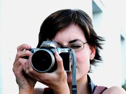 girl with analog camera close up