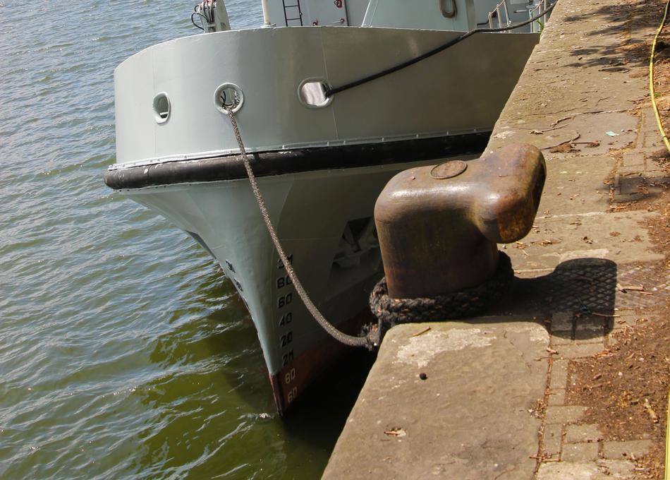 boat tied to a bridge