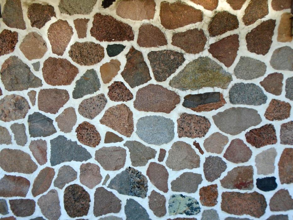 Macro photo of the colorful stone wall with shapes