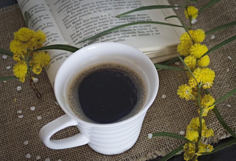 cup of coffee on a background of flowers