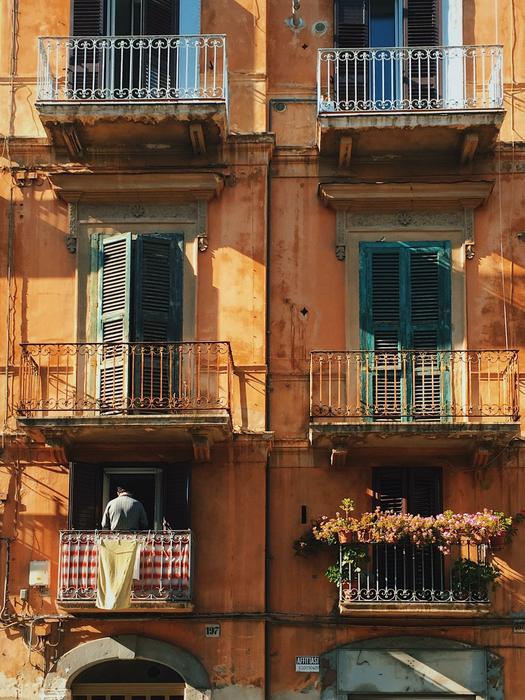 yellow house with balconies