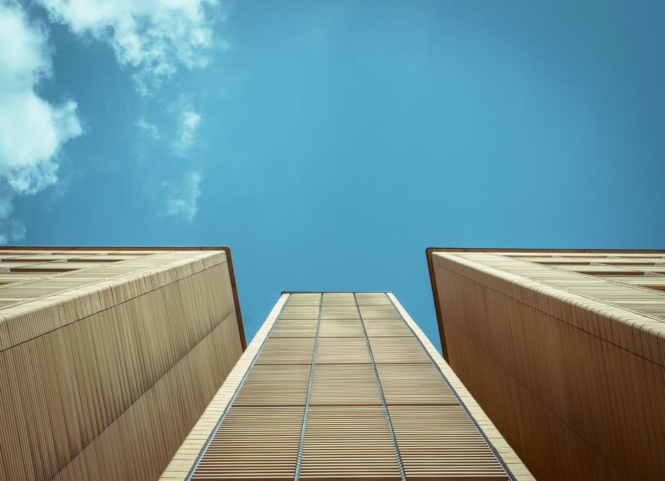 high-rise buildings with wooden facades