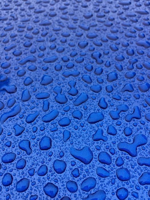 blue background in water droplets
