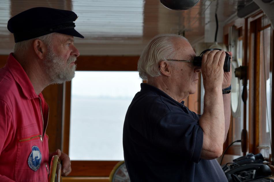 steamer captain with binoculars