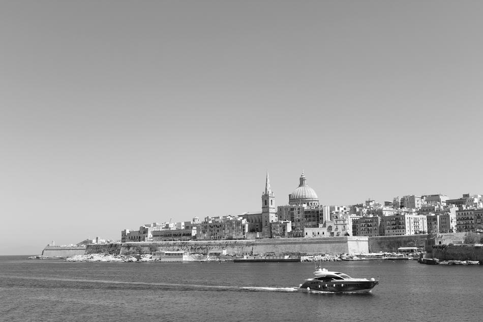 a ship by the beautiful city by the sea