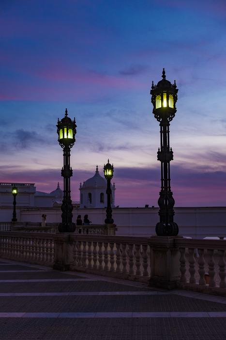 vintage lanterns on bridge at purple sky