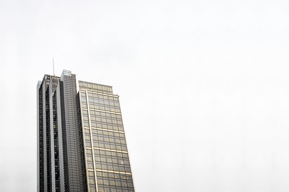 Colorful building with windows, at white sky on background