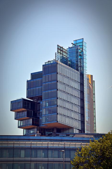 Shiny 'Nord LB' building with windows, near the colorful plant, in Hanover, Germany