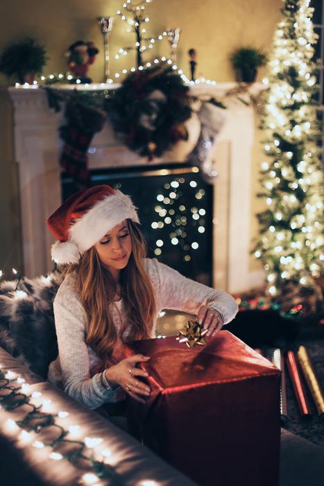 girl with a big box of christmas gifts