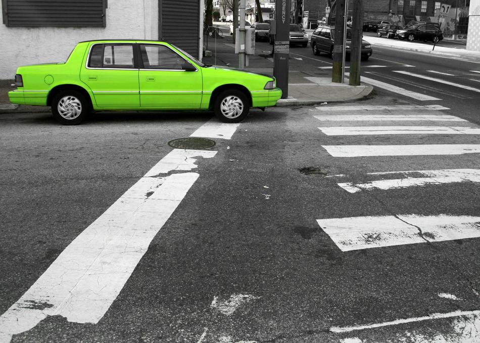 green car on the road
