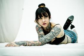 Sexy Girl with Tattoos laying
