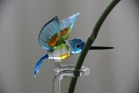 glass bird by the branch