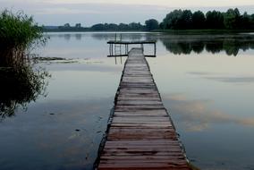 wooden bridge by the lake