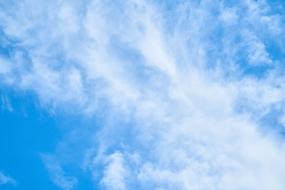 white clouds on a blue sky background