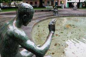 male sculpture at Fountain, switzerland, Zurich